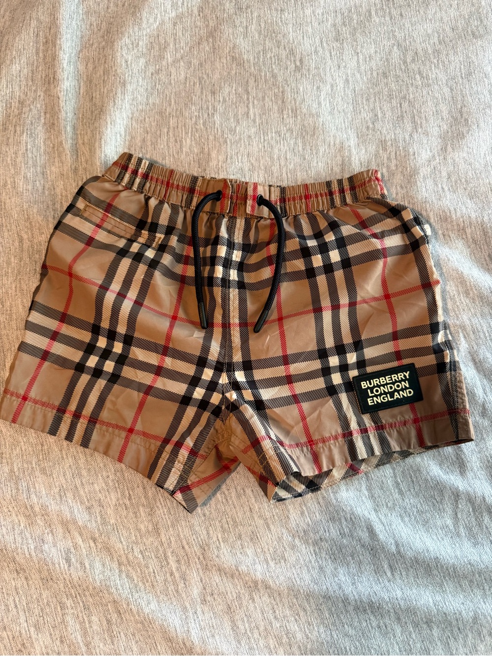 Authentic Burberry Tan Plaid Check Swim Shorts w/ Black & Red Accents 12 months